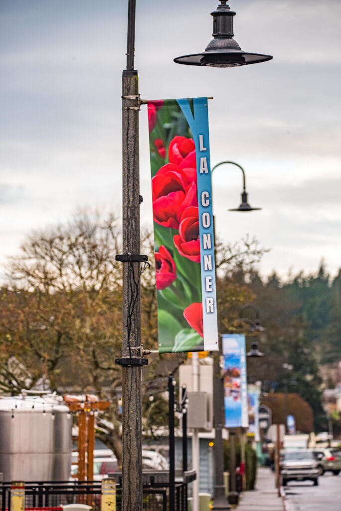The La Conner Banner Project, an exciting initiative aimed at celebrating local photographers and beautifying Morris Street with their stunning work, now seen along downtown La Conner. 